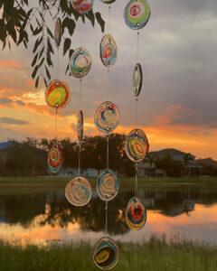 The Tinkling Glass Of Wind Chimes At Sunset